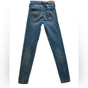 American Eagle Outfitters Blue Skinny Jeans with Gold Stitching.  Size 2 reg.